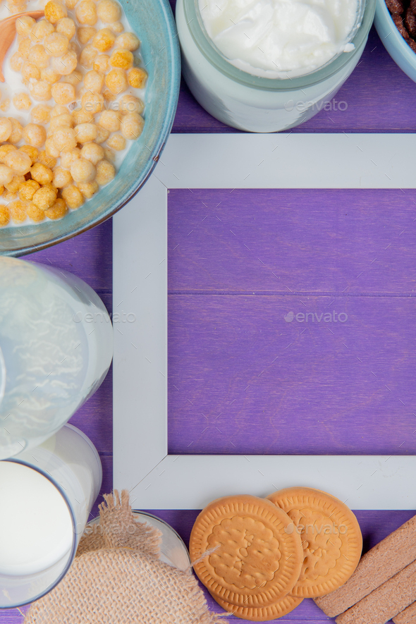 top view of milk products as milk, cream with cookies, cereals around